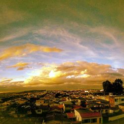 High angle shot of townscape against sky at sunset