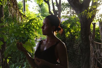 Portrait of young woman in forest