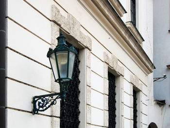 Low angle view of street light against building