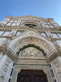 Low angle view of building against clear blue sky