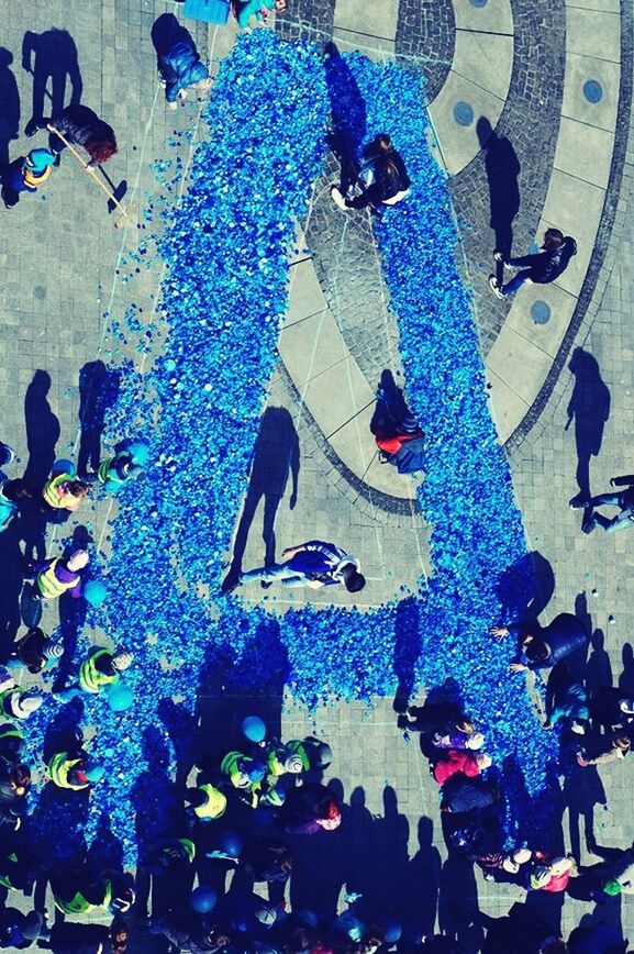 lifestyles, large group of people, men, leisure activity, person, high angle view, crowd, togetherness, enjoyment, multi colored, fun, standing, variation, street, celebration, abundance, outdoors, performance, dancing