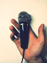 Close-up of human hand against white background