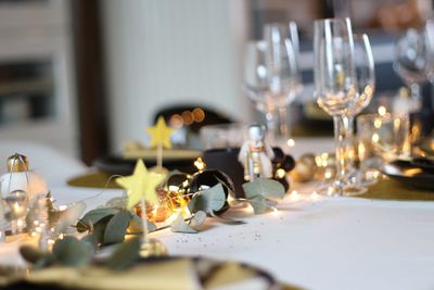 Close-up of wine glasses on table