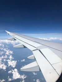 Aerial view of airplane flying in sky