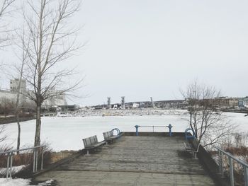 Scenic view of canal against clear sky during winter