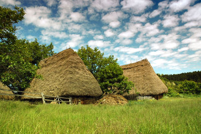 Wooden huts with thatched roof in the mountains. transylvania, romania