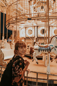 Woman standing in amusement park