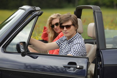 Young couple traveling in car