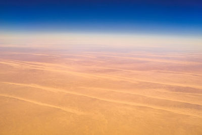 Aerial view of landscape against sky during sunset