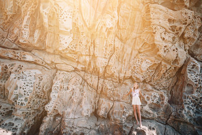 Woman standing on rock