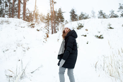 Man standing on snow covered land
