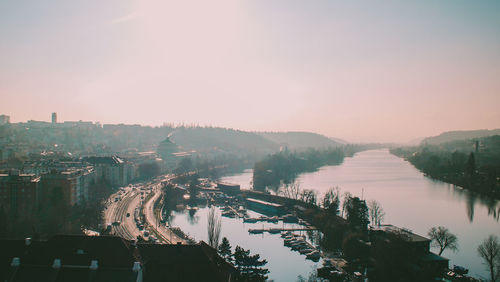 High angle view of river amidst trees against sky