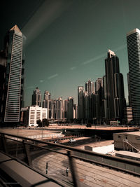 Modern buildings in city against sky