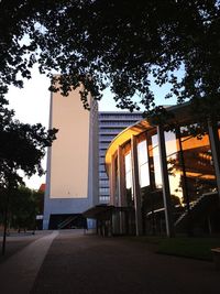 Low angle view of building against sky at sunset