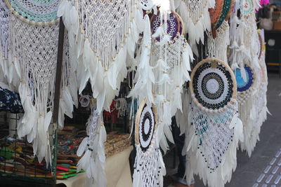 Clothes hanging in store for sale at market stall