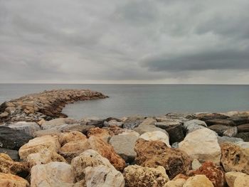 Scenic view of sea against cloudy sky