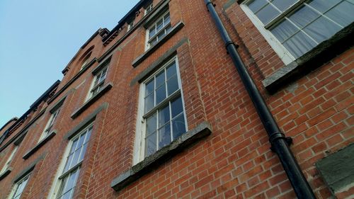 Low angle view of residential building against sky