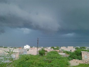 Scenic view of mountains against cloudy sky