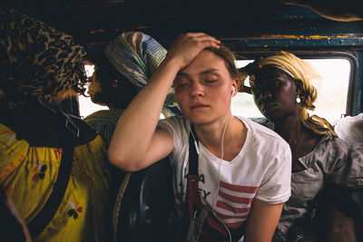 Portrait of a young woman looking down