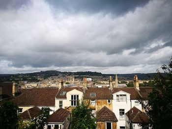 Houses in city against sky