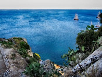 Scenic view of sea against blue sky