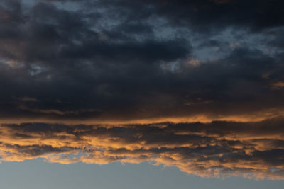 Low angle view of dramatic sky during sunset