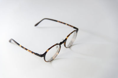 Close-up of sunglasses against white background