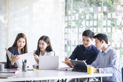 Group of people working on table