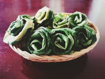 High angle view of vegetables in basket on table