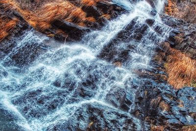 Full frame shot of water flowing through rocks