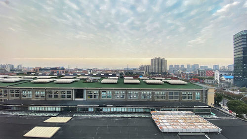 High angle view of buildings against sky during sunset