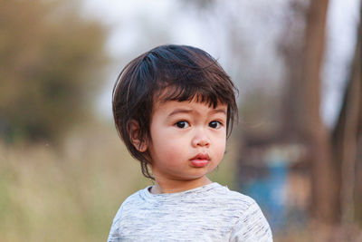 Portrait of cute boy looking away