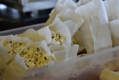 Close-up of popcorn in paper bags for sale in store