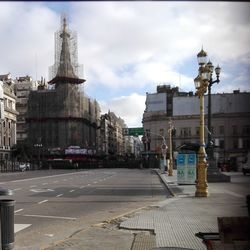 View of buildings against cloudy sky