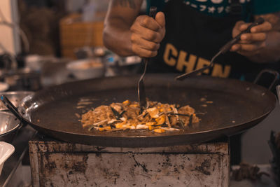 Close-up of person preparing food in kitchen