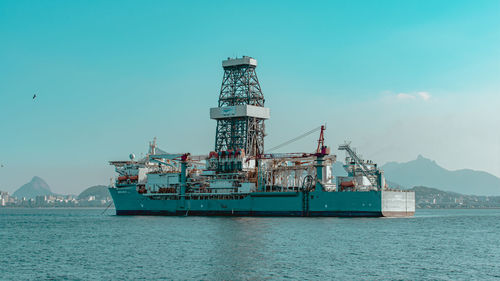 Ship in sea against blue sky