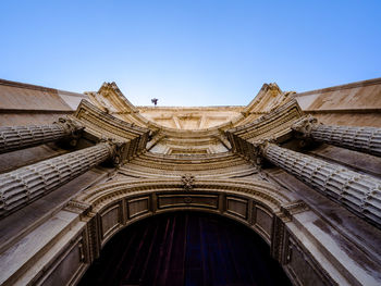 Low angle view of building against clear blue sky