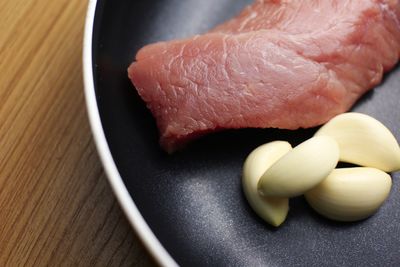 High angle view of meat in plate on table