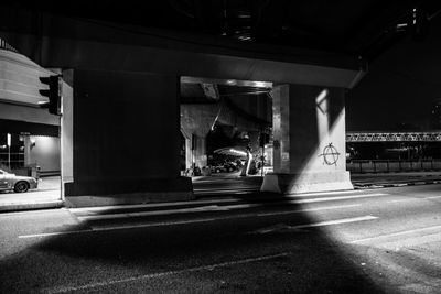 Road along buildings at night