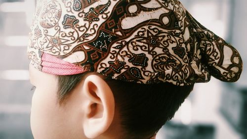 Close-up of boy wearing cap