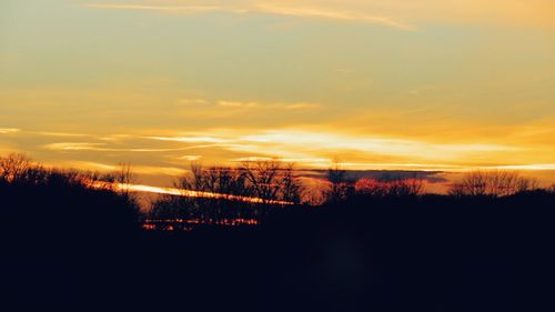 Scenic view of silhouette landscape against sky during sunset