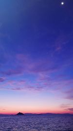 Scenic view of sea against sky at sunset