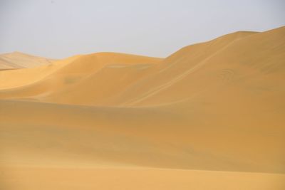 Scenic view of desert against clear sky