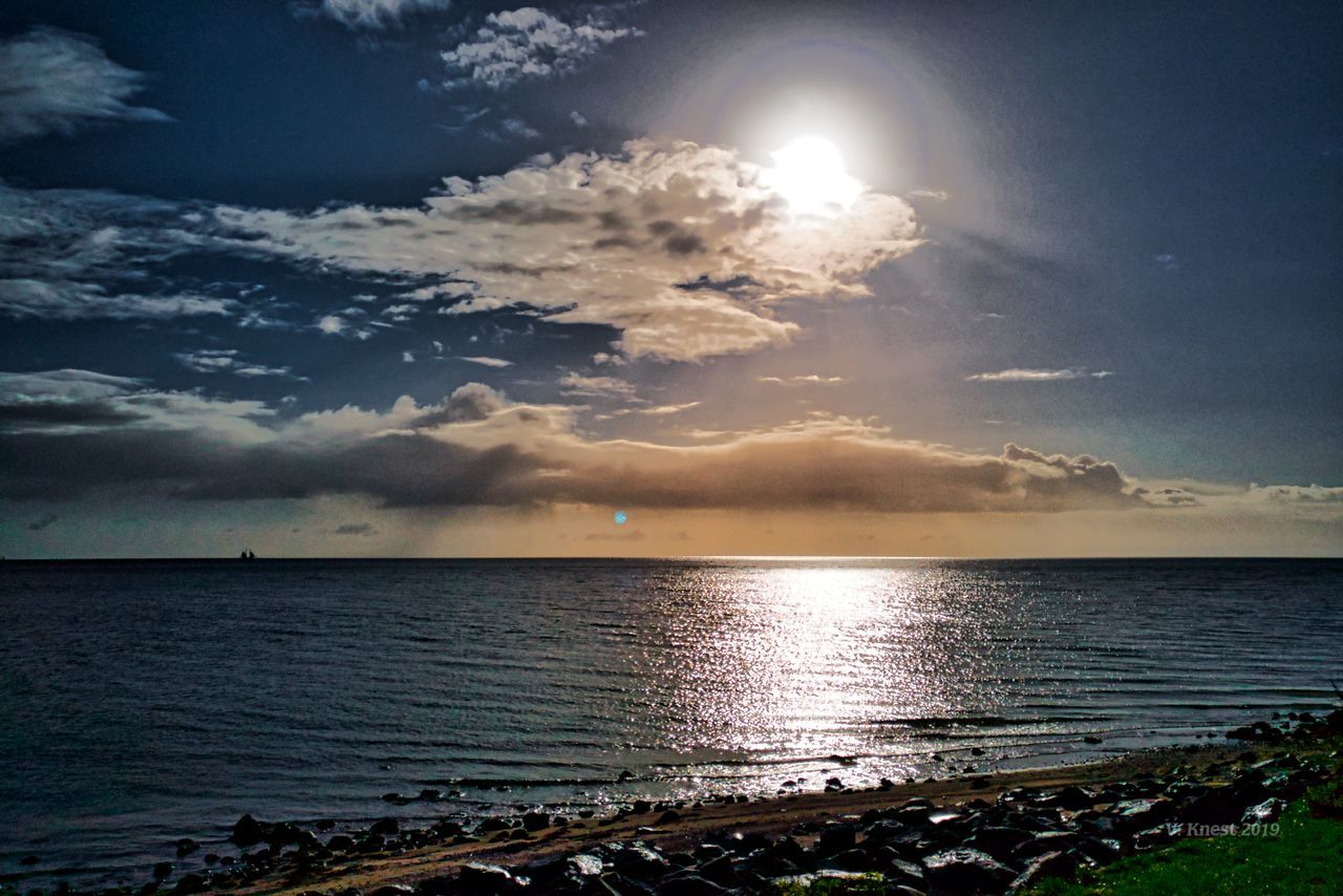 sky, water, sea, scenics - nature, cloud - sky, beauty in nature, horizon, tranquil scene, horizon over water, sunlight, tranquility, sun, nature, beach, land, no people, sunbeam, idyllic, reflection, outdoors, bright, brightly lit