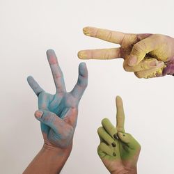 Close-up of hand against white background