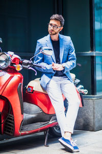 Portrait of young man sitting outdoors