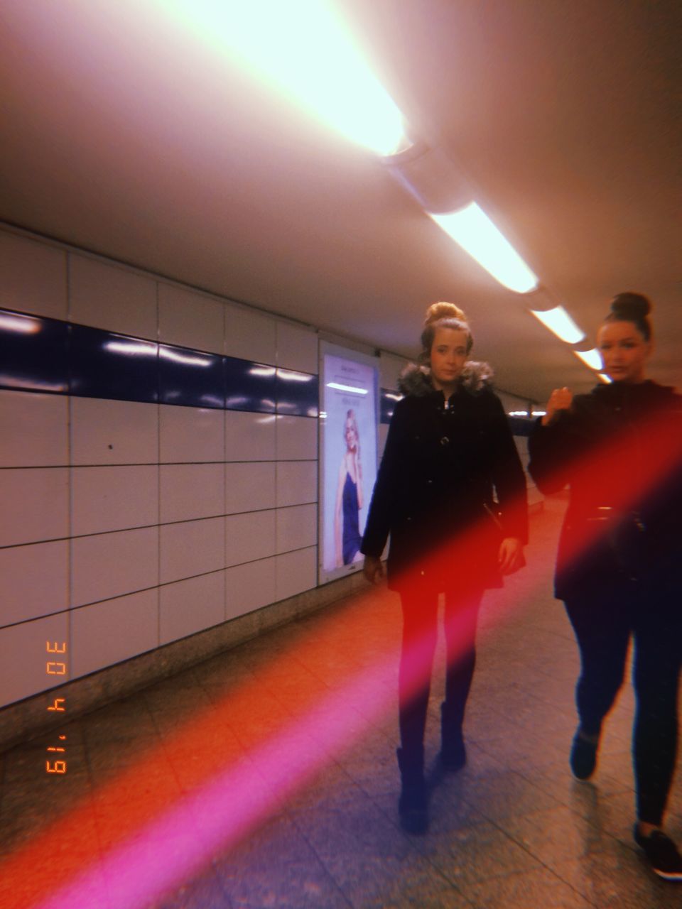 illuminated, real people, full length, men, indoors, lifestyles, women, people, architecture, leisure activity, walking, adult, casual clothing, public transportation, subway, group of people, incidental people, lighting equipment, ceiling