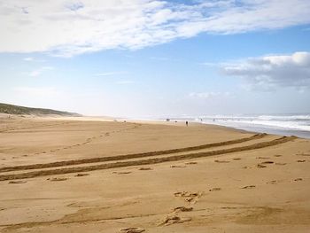 Scenic view of beach against sky