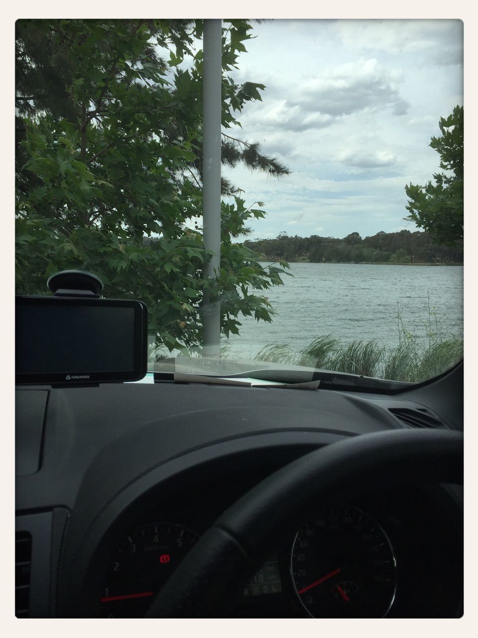 transportation, mode of transport, land vehicle, car, sky, tree, vehicle interior, car interior, part of, transfer print, road, cropped, travel, side-view mirror, windshield, cloud - sky, auto post production filter, reflection, bicycle, road trip