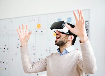 Portrait of man using virtual reality simulator